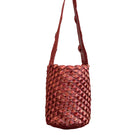 Verdi shoulder bag featuring a copper and magenta seashell design with a soft leather strap and artistic detailing.