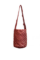 Verdi shoulder bag featuring a copper and magenta seashell design with a soft leather strap and artistic detailing.