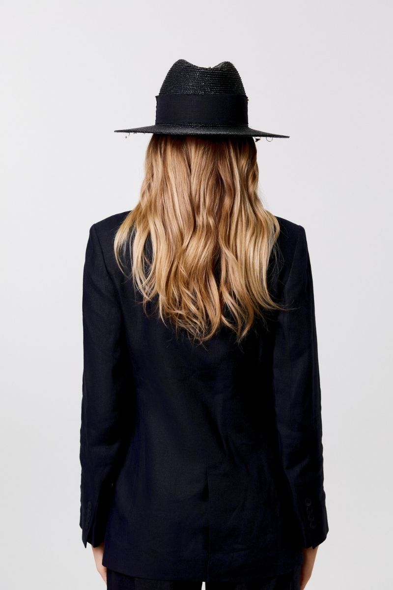 Black fedora hat by LE SH KA with shell embellishments and 24K gold-plated accessories, showcasing a stylish, sophisticated design.