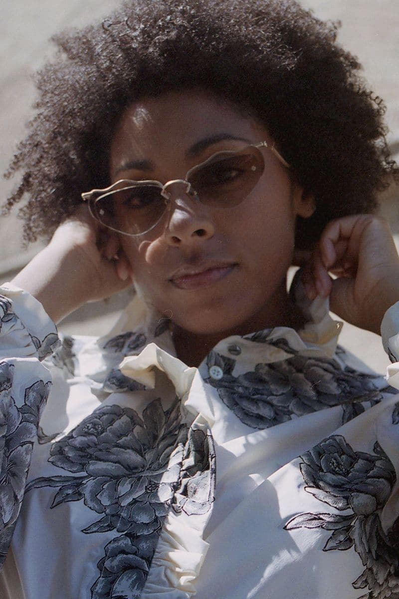 Brown Forget Me Not sunglasses by Moy Atelier with round frames and tinted lenses, shown on a neutral background.