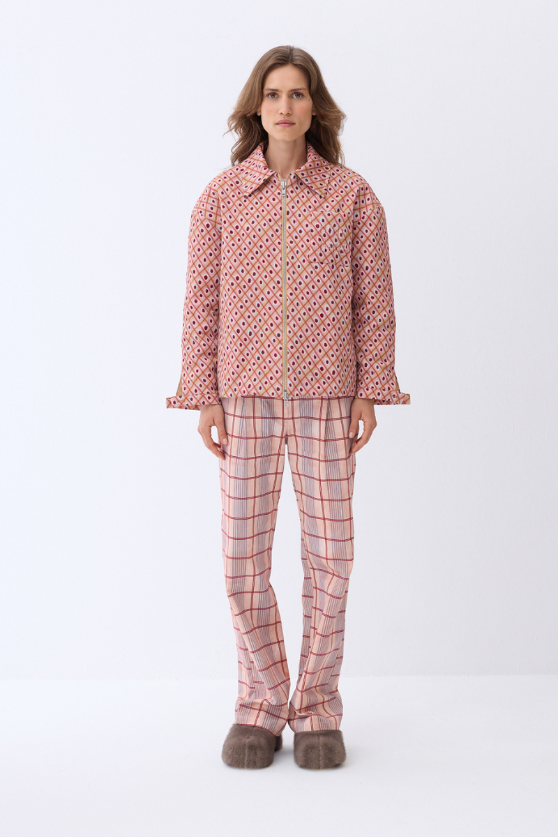 ColoReve printed gabardine pants in salmon pink with a tailored fit, featuring a sleek, smooth fabric and stylish design.