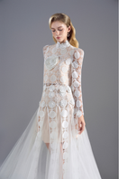 White long sleeve semi-sheer lace maxi dress by Rosee de Matin featuring intricate lace details and a flowing silhouette.