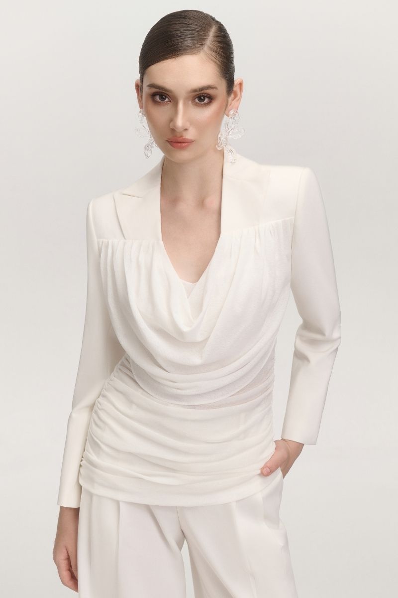 White JEMMIA top by Arti Apparel, showcasing a stylish sleeveless design with a fitted silhouette and soft fabric.