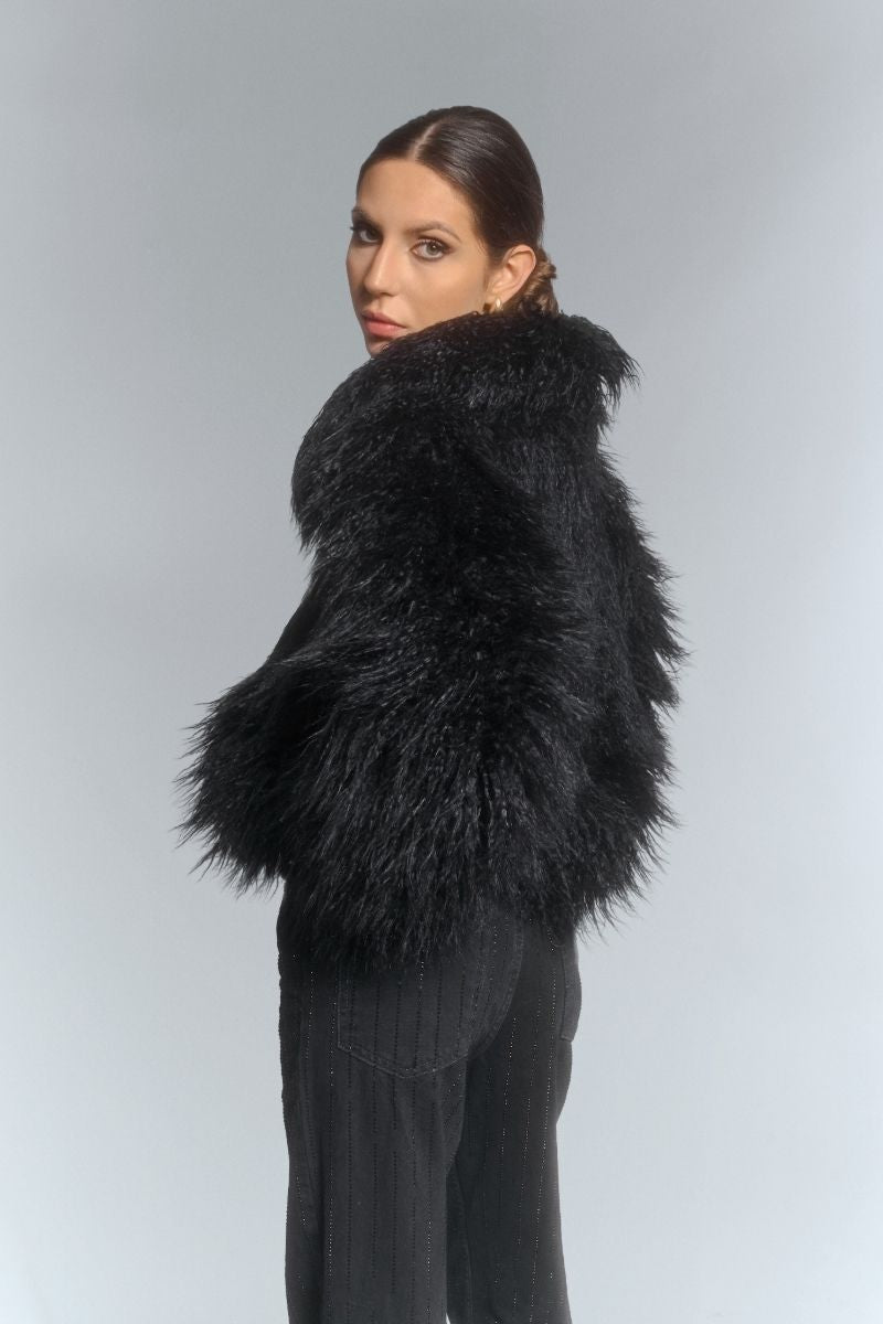 Black fluffy faux fur jacket by Fortini, stylish and cozy jacket with plush texture, perfect for cold weather.