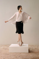 Lecia gentle long sleeve shirt in ivory, soft fabric with a relaxed fit, shown on a hanger against a neutral background.