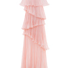 Pink tiered gown by Le Thanh Hoa featuring ruffled layers and flowing fabric, perfect for elegant occasions.