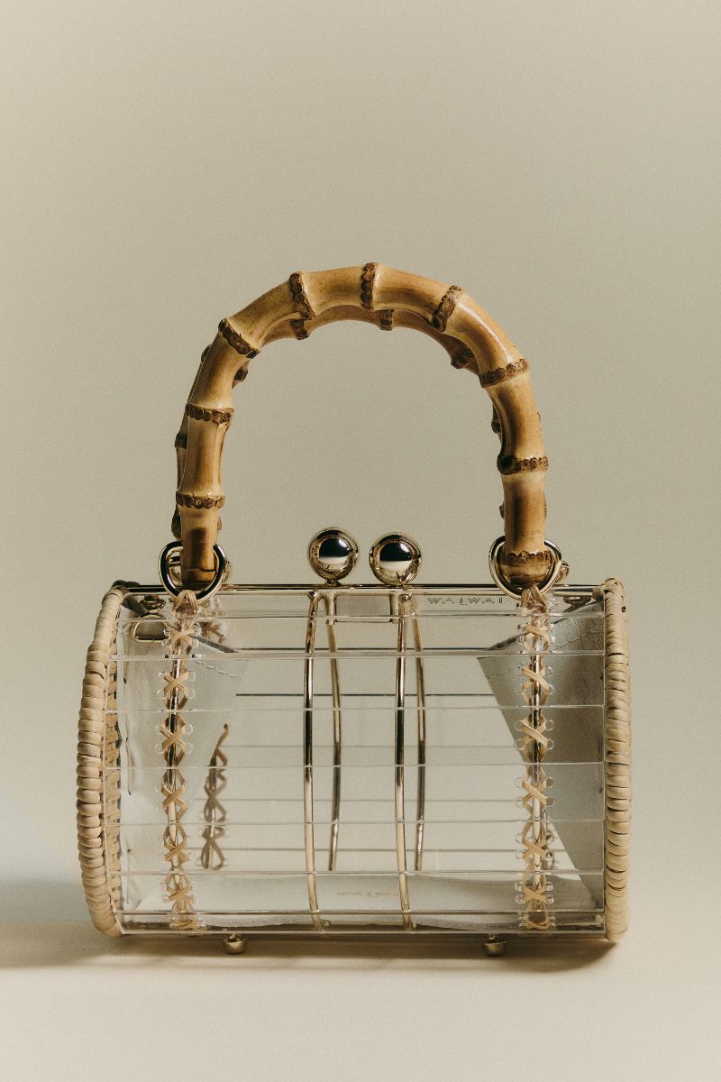 Waiwai Rio Alix Bambu Bag in Crystal, a stylish clear top handle bag with bamboo accents and transparent design.