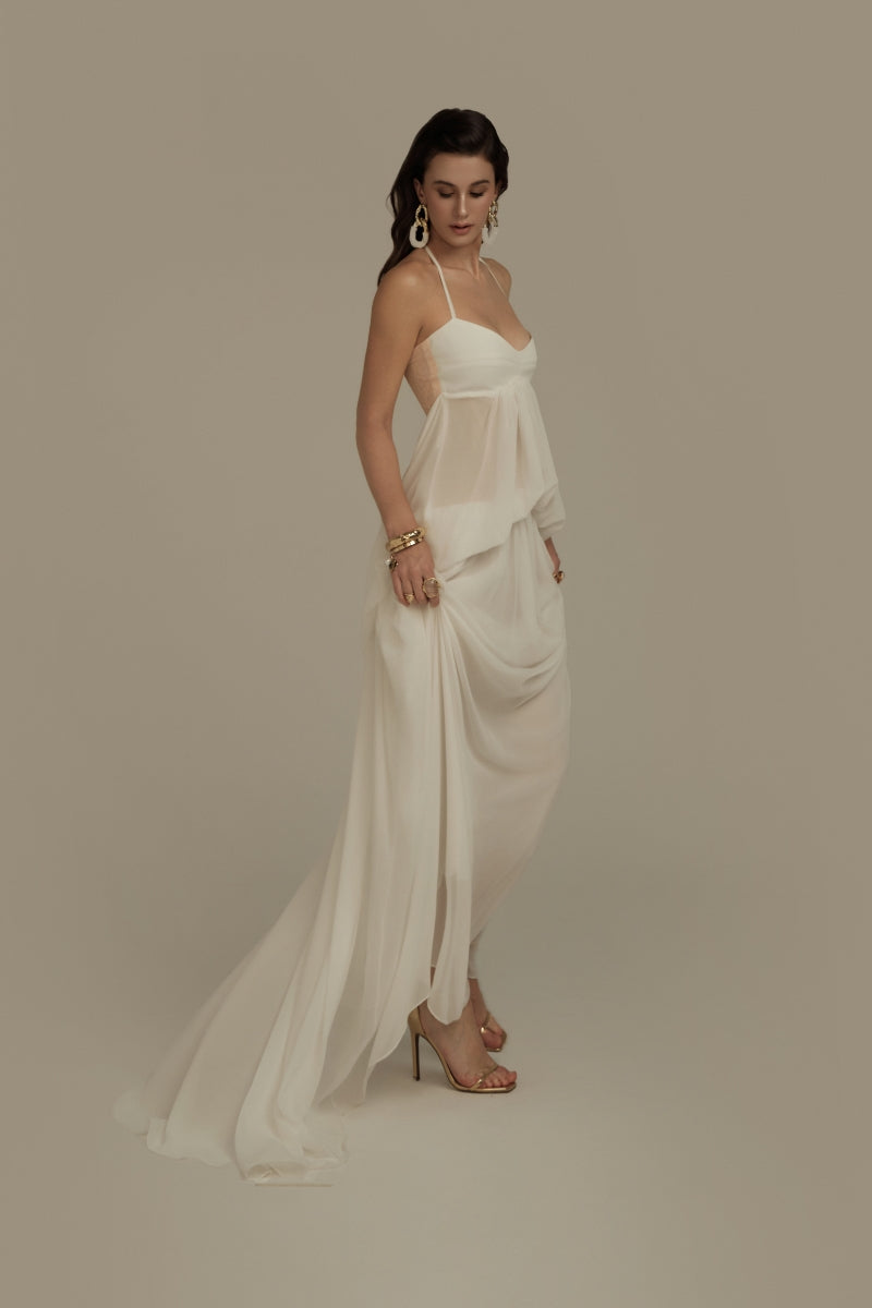 Poem Halcyon white maxi dress displayed on a hanger, flowing fabric, elegant design perfect for summer or casual occasions.