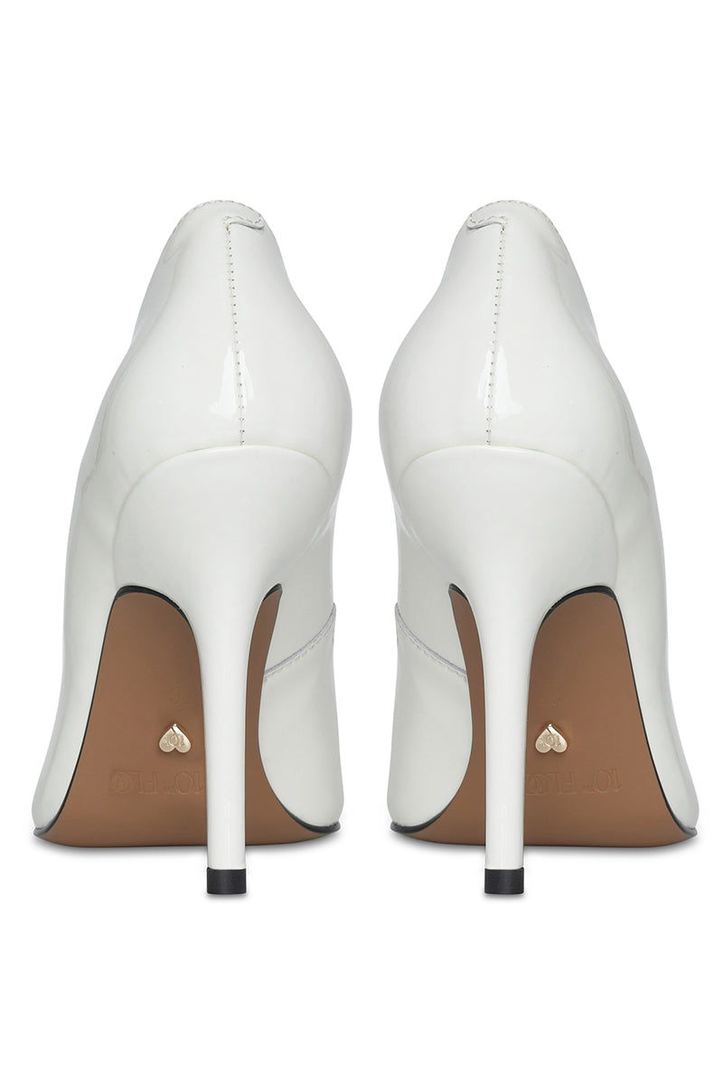 White 10th Floor Uptown heel in a stylish high-heeled shoe design with sleek straps and pointed toe.