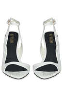 White MIDNIGHTS heels by 10TH FLOOR, stylish high-heeled shoes with sleek design and elegant ankle straps.