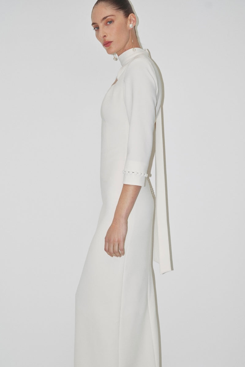 Elegant JC Pajares double crepe maxi dress with long sleeves, showcased in a bridal-inspired look.