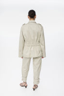 Dāl the Label canvas cotton jacket with a relaxed fit, featuring button closures and a casual style.