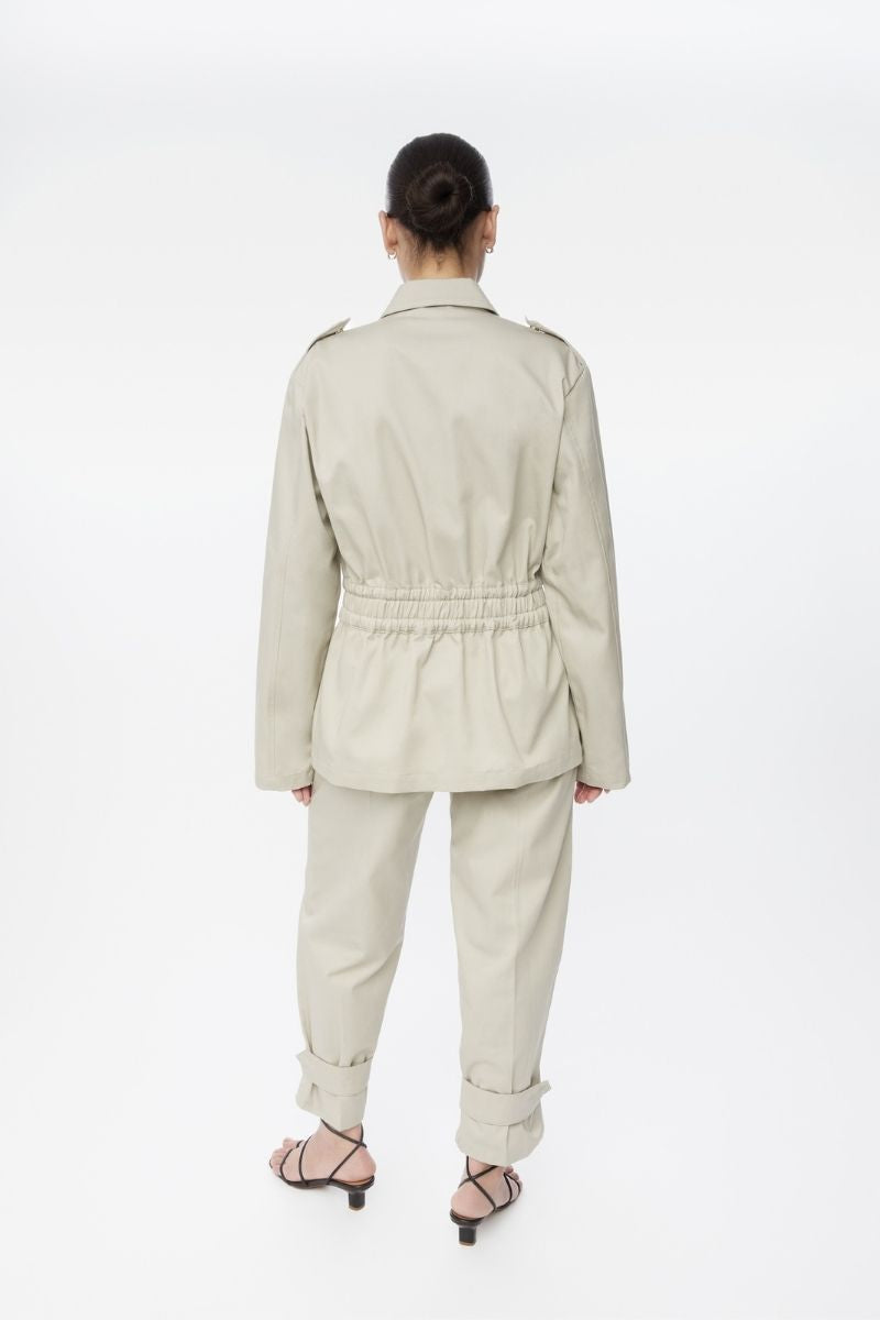 Dāl the Label canvas cotton jacket with a relaxed fit, featuring button closures and a casual style.