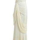 Deme By Gabriella Naomi maxi dress in off-white with flowing fabric and elegant design, perfect for summer or special occasions.