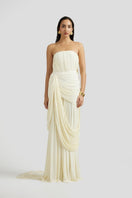 Deme By Gabriella Naomi maxi dress in off-white, flowing fabric with a relaxed fit and elegant design.