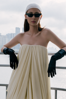 Elegant Butter Muse gown by TONYY featuring flowing fabric and intricate detailing, perfect for formal occasions.