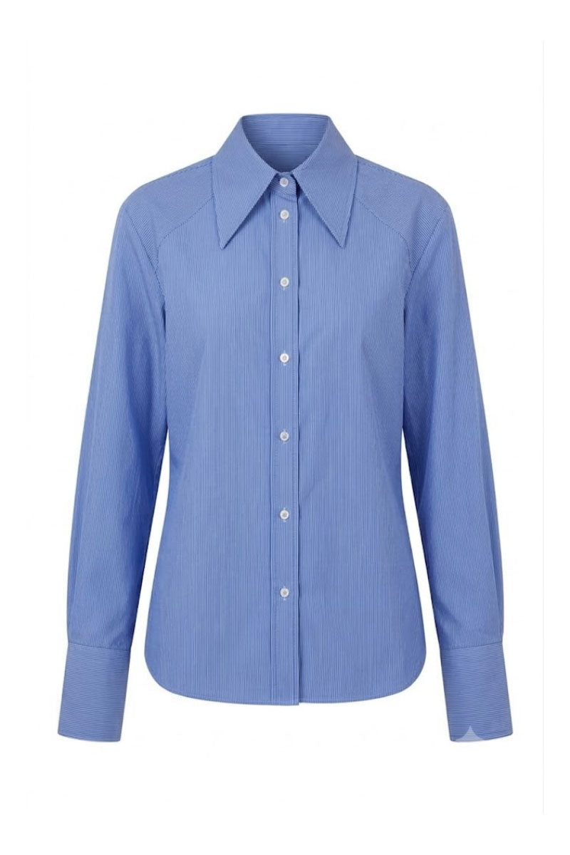 Blue New Thera Shirt by Keira Tong, a casual button-up shirt with a relaxed fit and stylish design, shown on a hanger.