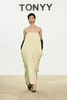Elegant Butter Muse gown by TONYY featuring flowing fabric and intricate details, perfect for formal occasions.