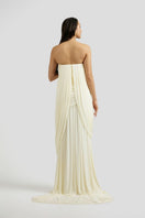 Deme By Gabriella Naomi maxi dress in off-white fabric, flowing design with a fitted bodice and elegant length.