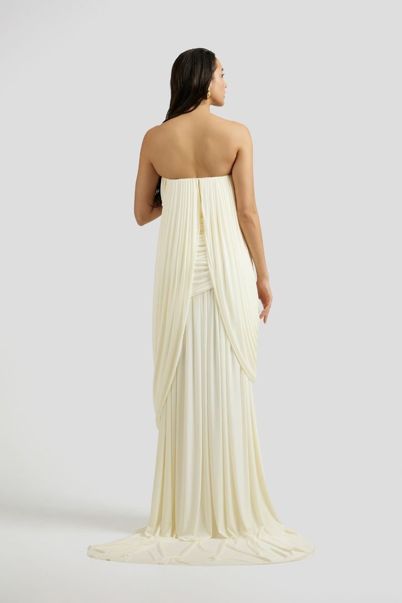 Deme By Gabriella Naomi maxi dress in off-white fabric, flowing design with a fitted bodice and elegant length.