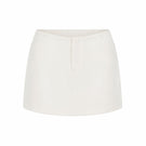 White minimal skort from Keira Tong, featuring a sleek mini design and clean silhouette, perfect for modern casual wear.