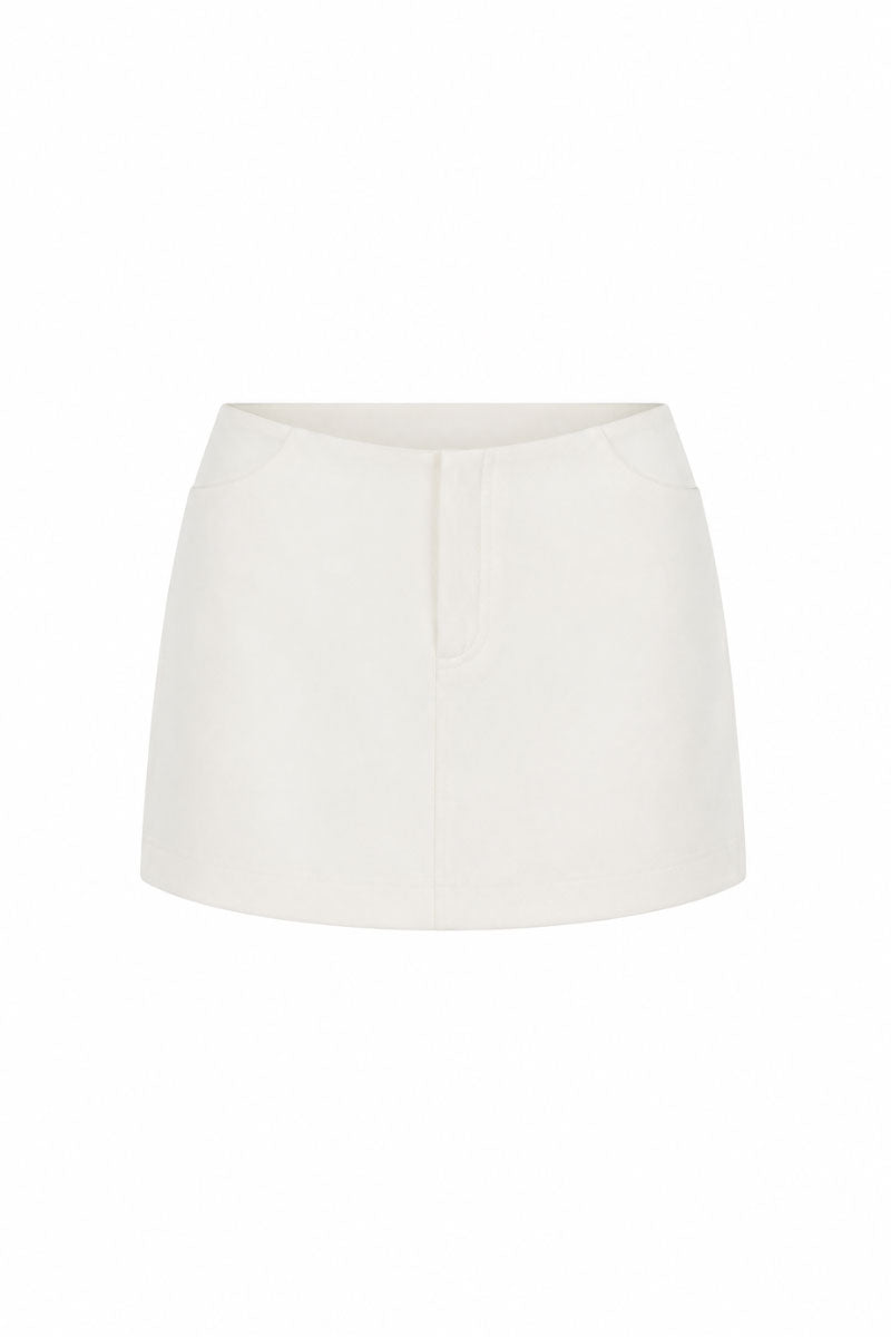 White minimal skort by KEIRA TONG, featuring a sleek mini skirt design with clean lines and a modern silhouette.
