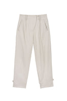 Dāl the Label canvas cotton pants showing relaxed fit and beige color, with visible pockets and stitching details.