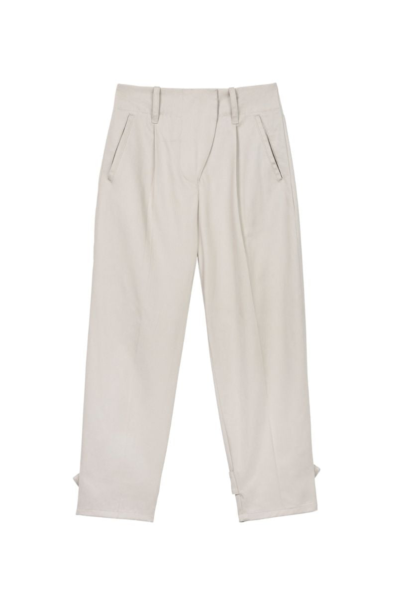 Dāl the Label canvas cotton pants showing relaxed fit and beige color, with visible pockets and stitching details.