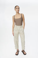 Dāl the Label canvas cotton pants in neutral color, relaxed fit with adjustable waistband and practical side pockets.