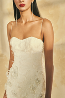 L'SCARLETT spaghetti strap fringe jacquard gown with intricate pattern, floor-length design, and elegant silhouette.