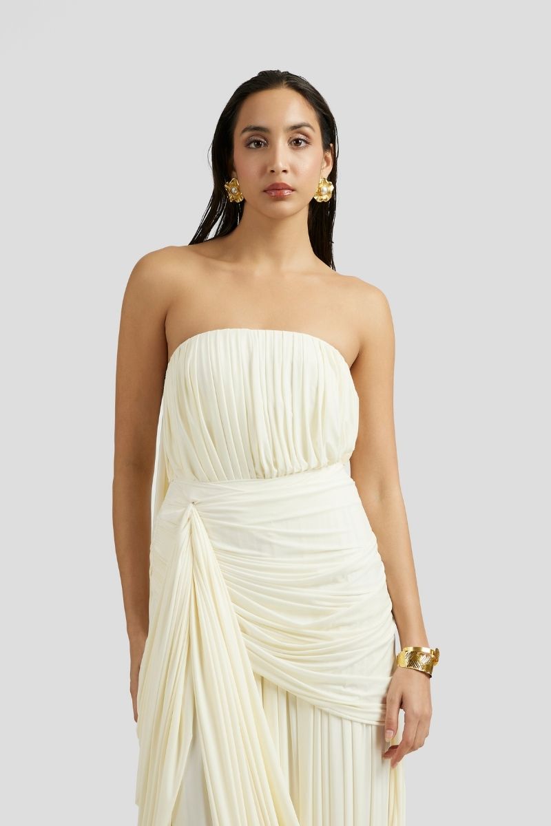 Deme By Gabriella Naomi maxi dress in off-white, flowing fabric with a relaxed fit and elegant design for casual or formal occasions.