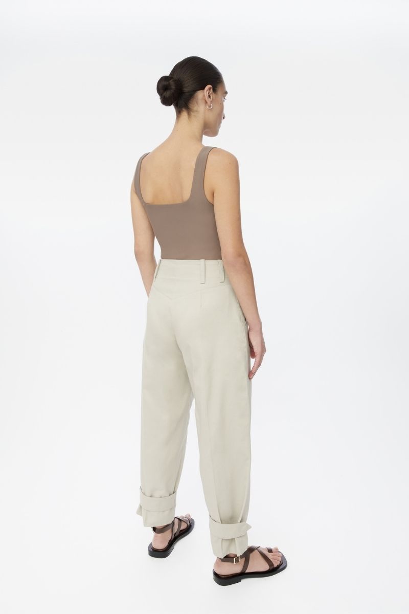 Light beige canvas cotton pants by Dāl the Label, featuring a relaxed fit and casual style, shown on a model.