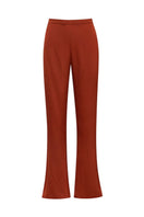 Baobab Numa pants in terracotta fabric, featuring a relaxed fit and stylish design, displayed on a neutral background.
