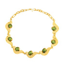 Green meteorite necklace by Jude Benhalim featuring a polished meteorite pendant on a delicate chain.