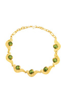 Green meteorite necklace by Jude Benhalim featuring a polished meteorite pendant on a delicate chain.