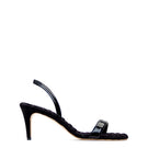 A pair of black patent-effect slingback sandals by AERA with a sleek, glossy finish and open-toe design.
