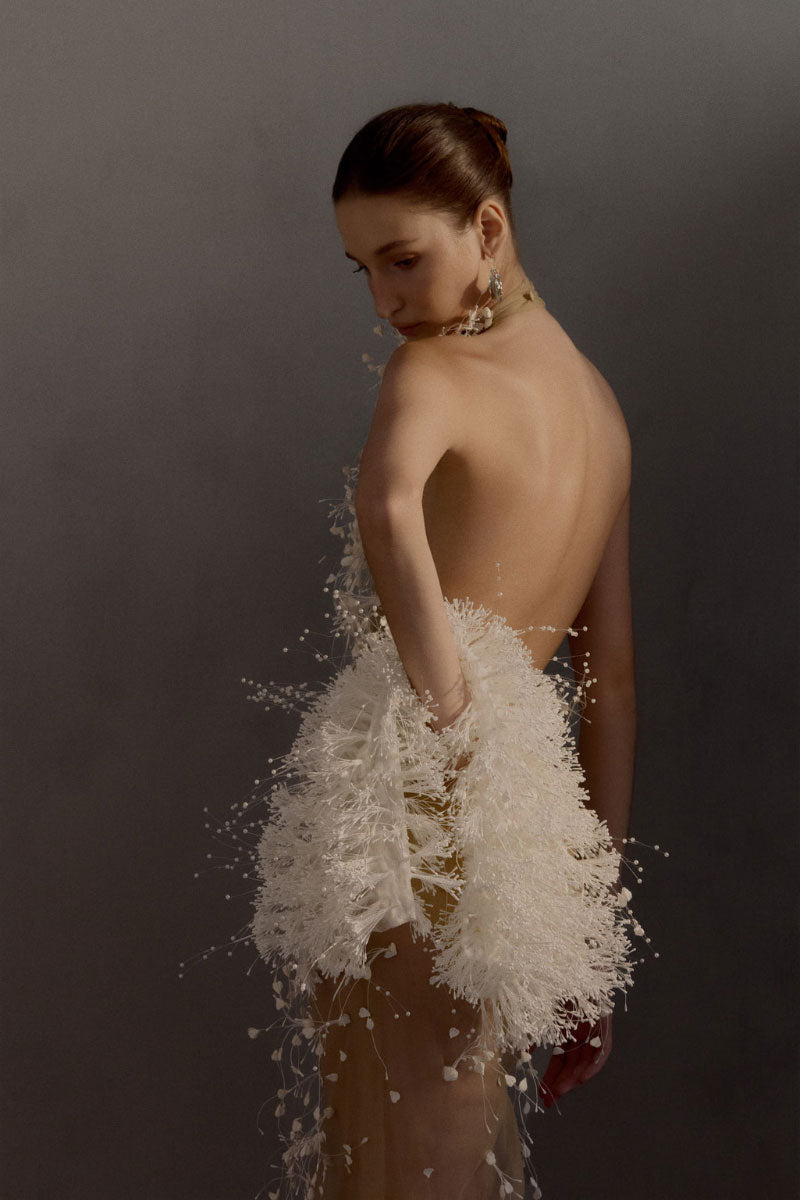 White Plan Maliston gown, elegant long dress with flowing fabric and subtle detailing, ideal for formal occasions.