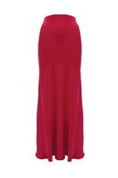 NiLuu Lucy slip skirt in rouge, a flowy maxi skirt with a smooth fabric finish, displayed on a hanger.