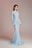Do Long Aurora Star Blue gown displayed on a hanger, showcasing its elegant design and flowing fabric.