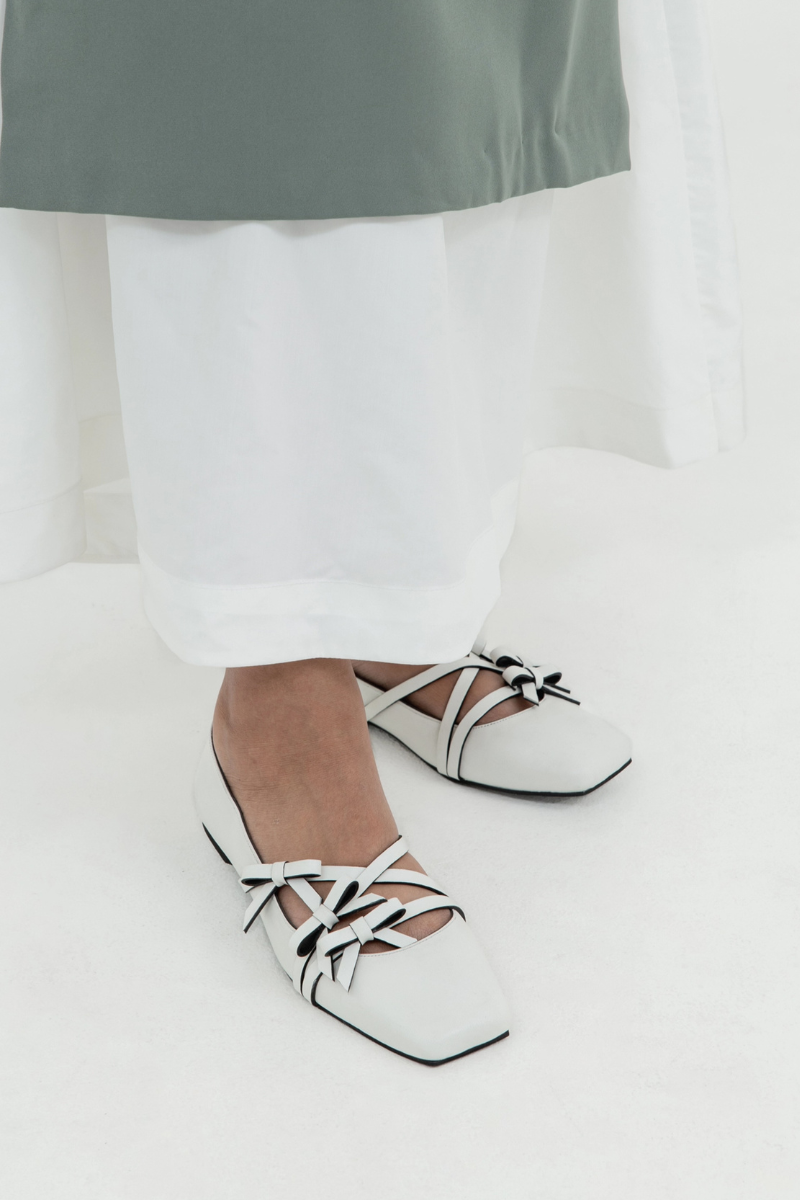 Christin Wu Annaya flats in white, stylish slip-on shoes with a sleek design and comfortable fit, perfect for casual wear.