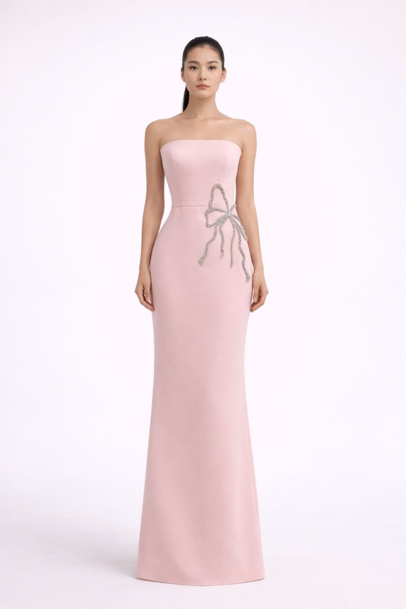 Nihan Peker pink gown with flowing fabric, elegant design, and detailed stitching, perfect for formal or special occasions.