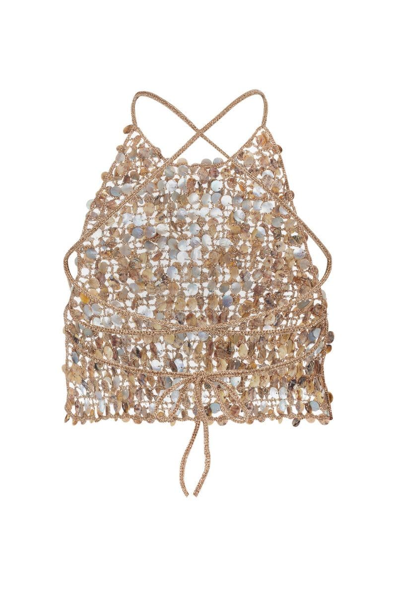 Crochet mother of pearl top by Mirel Prentice featuring intricate crochet pattern and shimmering pearl accents, displayed on a hanger.