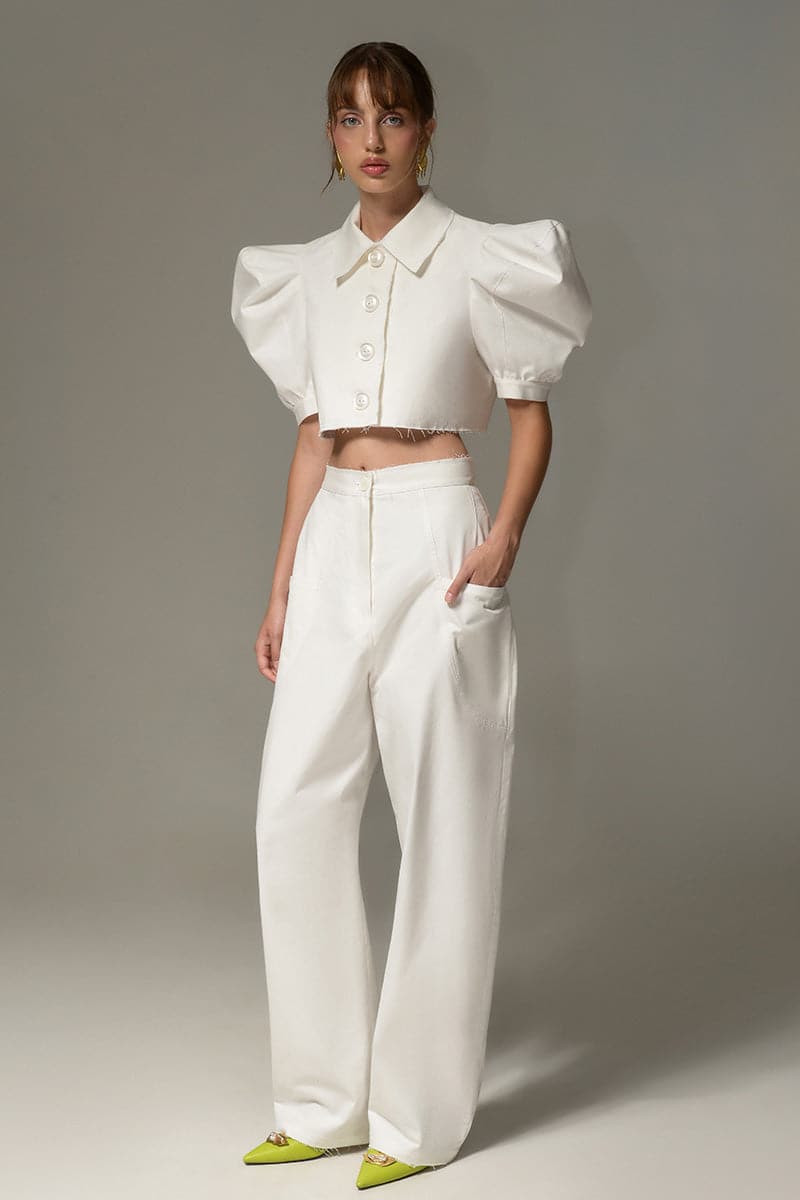 Liya white cloud crop top with long sleeves and fitted design, styled on a model against a neutral background.