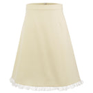 Chictopia Bonnie mini skirt in pastel yellow, showcasing lightweight fabric, high waist design, and stylish fit on a model.