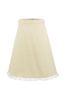 Chictopia Bonnie mini skirt in pastel yellow, showcasing lightweight fabric, high waist design, and stylish fit on a model.