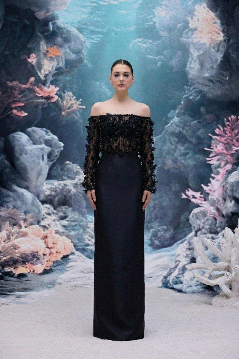 Black YVETTE tulle and royal taffeta gown by 21Six, flowing design with layered fabric and elegant details.
