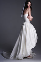Elegant BALYKINA ELODIE gown with flowing fabric and intricate detailing, perfect for formal occasions.