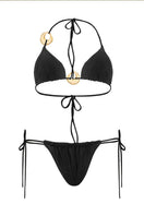 Black Selena bikini from Laura Escobar featuring a stylish, fitted bikini top and matching bottoms on a plain background.