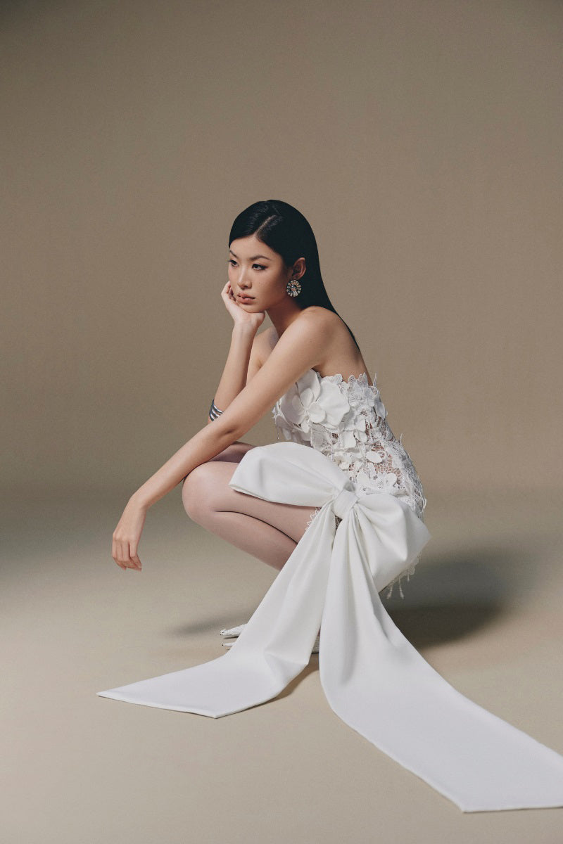 Keira Tong Orchid Mini Dress featuring a fitted silhouette and floral pattern, shown on a model.