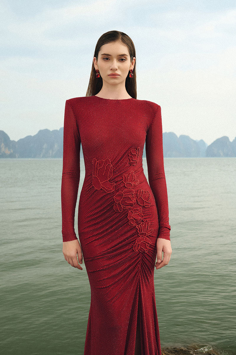 Red glitter stretch gown from Lune De Soie featuring a fitted silhouette and elegant design for formal occasions.